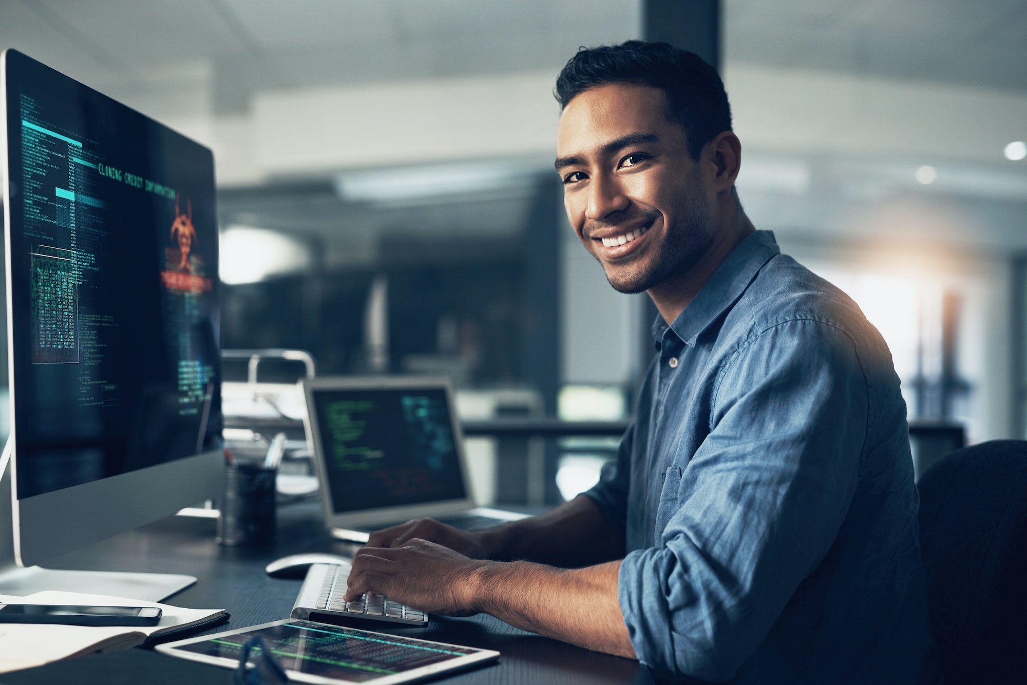 Portrait of a man using a computer in a modern office